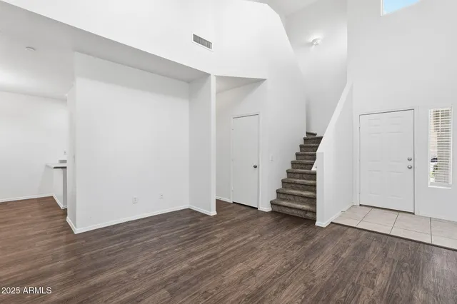 a kitchen with cabinets and steel stainless steel appliances