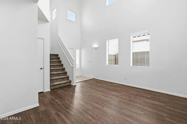 a view of a kitchen with a stove cabinets and wooden floor