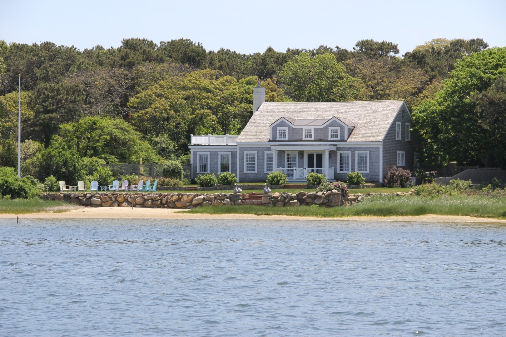 a view of a house with a yard and a large pool