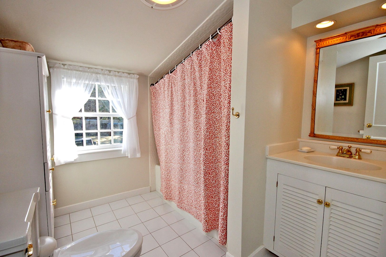 9 Fowler Avenue Edgartown, MA 02539 - Photo 21 of 28 a bathroom with a sink and a mirror