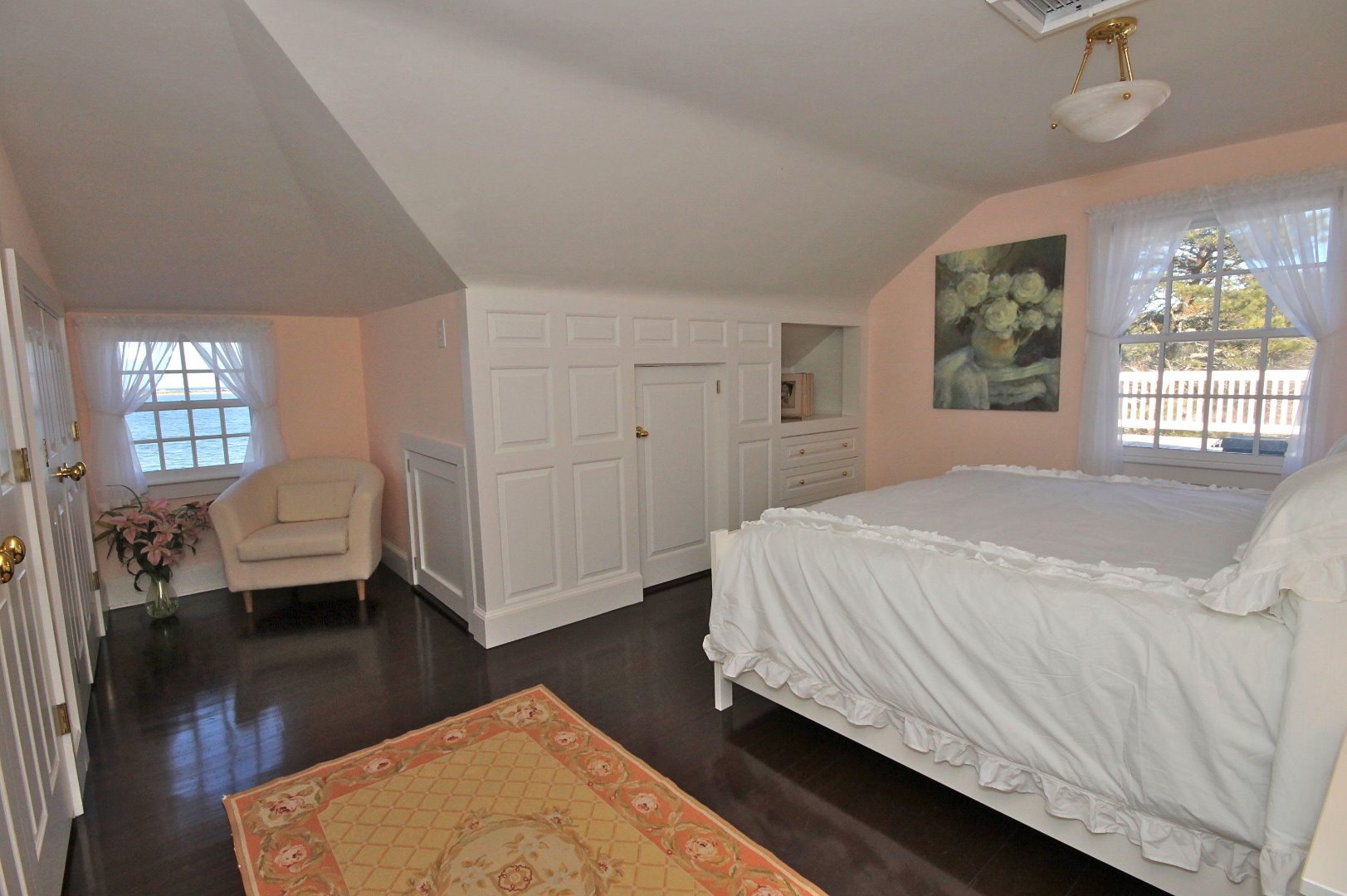 9 Fowler Avenue Edgartown, MA 02539 - Photo 22 of 28 a spacious bedroom with a bed and wooden floor