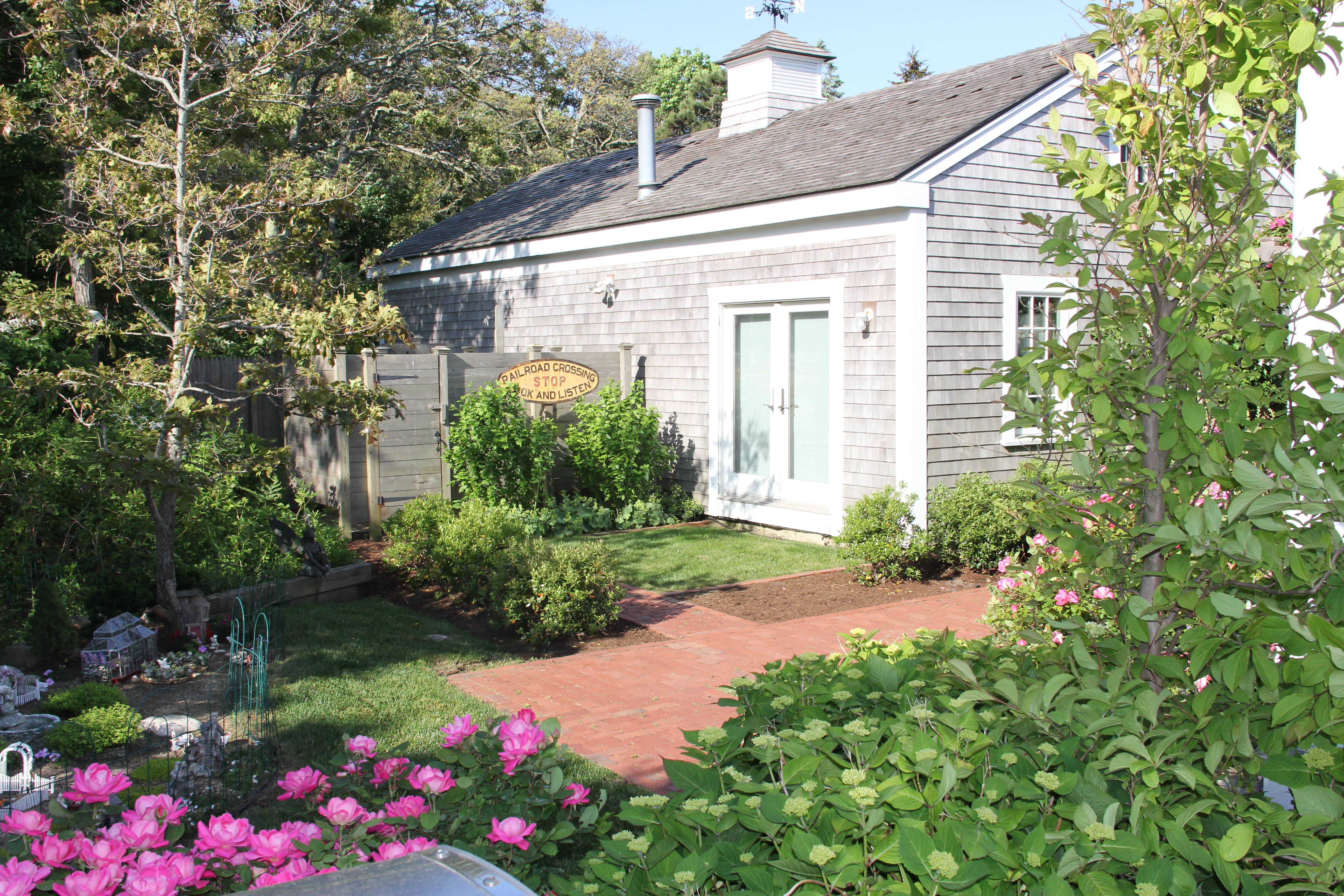 9 Fowler Avenue Edgartown, MA 02539 - Photo 6 of 28 a view of a house with a backyard and garden