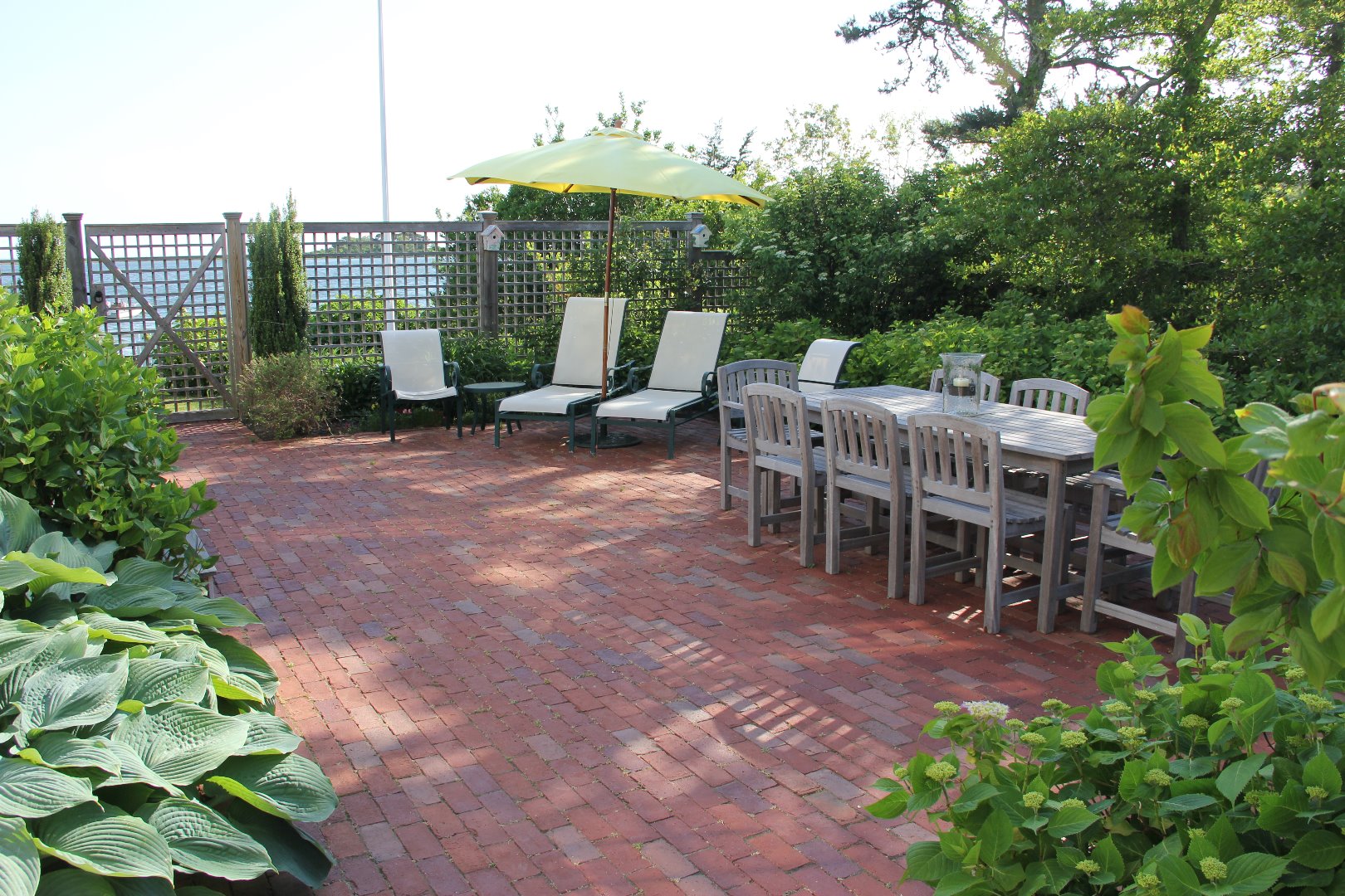 9 Fowler Avenue Edgartown, MA 02539 - Photo 7 of 28 a view of a chairs and table in the garden