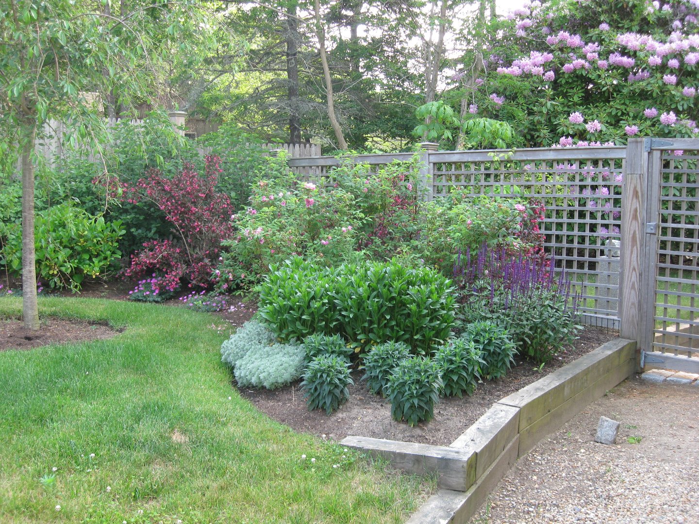 9 Fowler Avenue Edgartown, MA 02539 - Photo 8 of 28 a view of a garden with a fountain