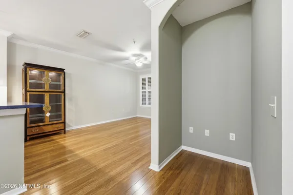 a view of a kitchen with wooden floor