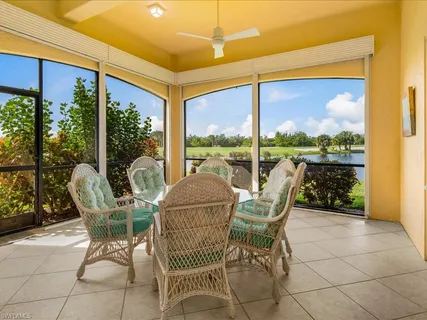 a view of a chair and tables in the patio