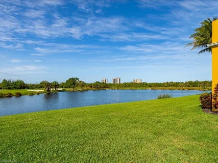 a view of a lake with houses in the back