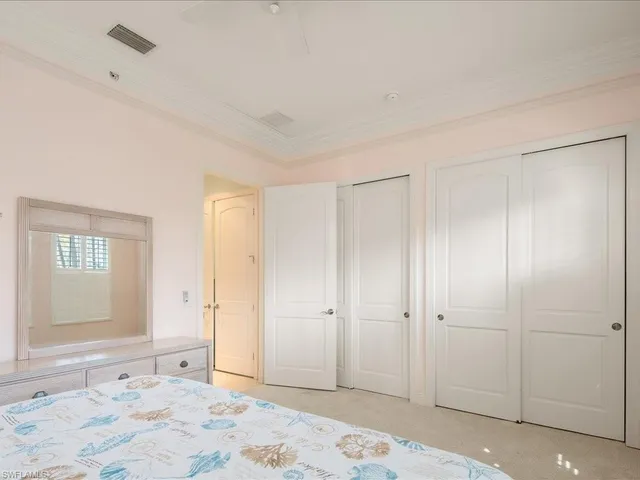 a view of a bedroom with a bedroom and windows