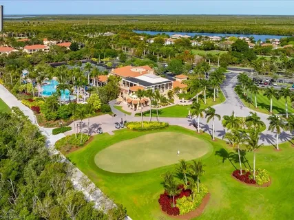 a view of a swimming pool with a table and chairs