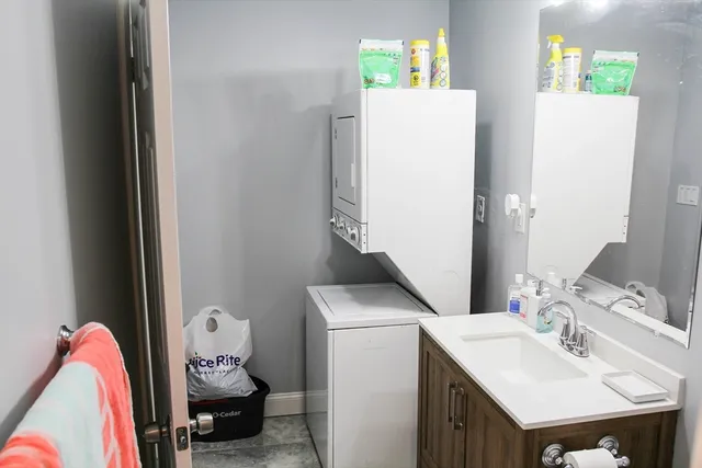 a bathroom with a sink toilet and vanity