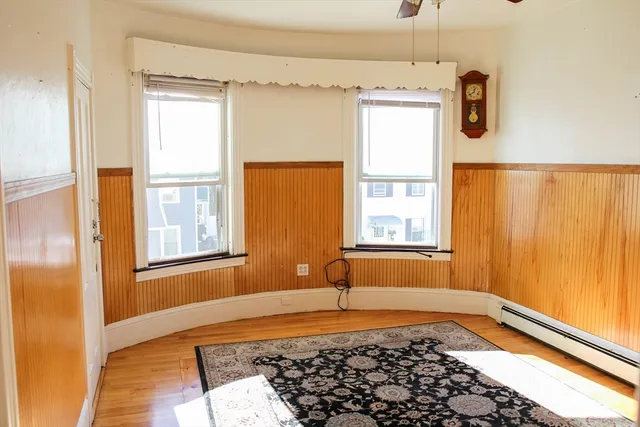 a bathroom with a tub sink and window