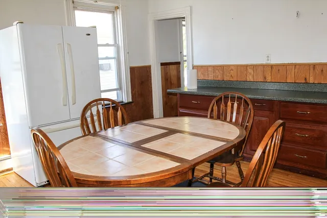 a view of a dining room with furniture