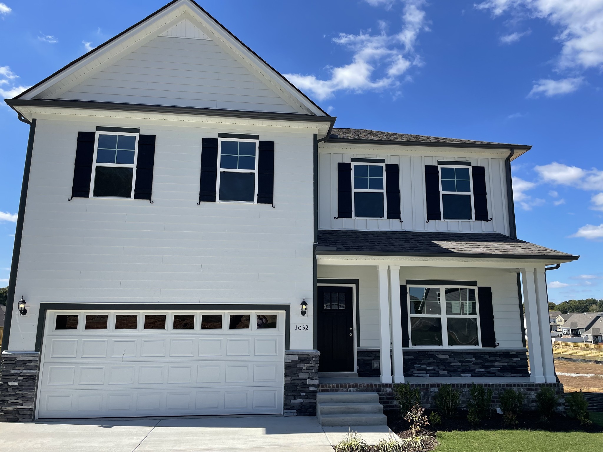 1032 Wiseman Farm Road Fairview, TN 37062 - Photo 1 of 8 a front view of a house with yard