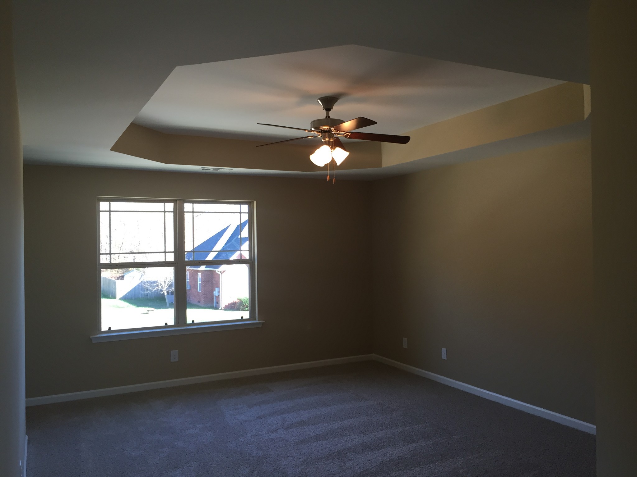 1032 Wiseman Farm Road Fairview, TN 37062 - Photo 7 of 8 an empty room with a window and a fan