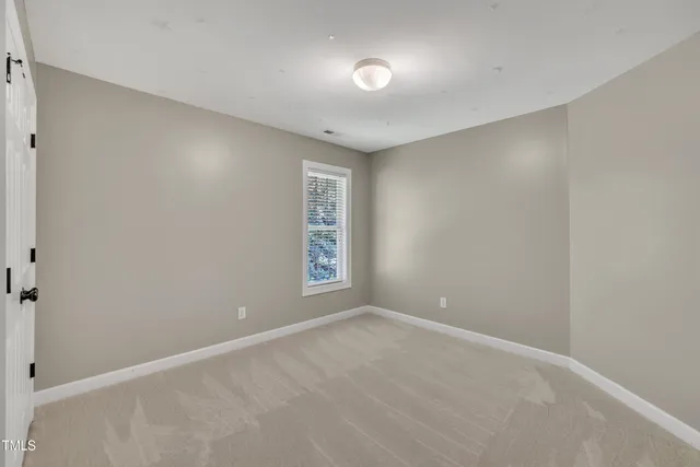 a view of a balcony with wooden floor