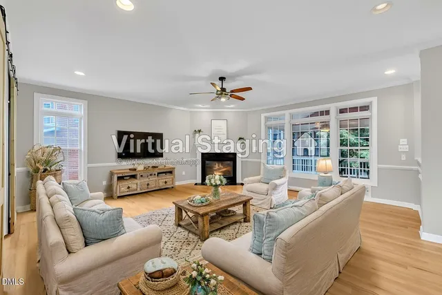 a kitchen with stainless steel appliances granite countertop a stove a sink dishwasher a refrigerator and a microwave