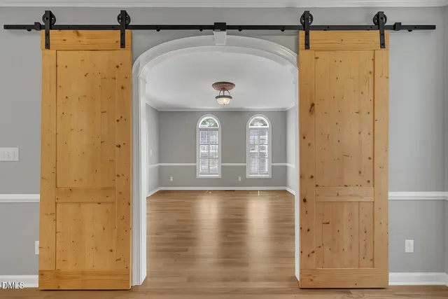 a kitchen with stainless steel appliances granite countertop a sink counter space cabinets and a large window