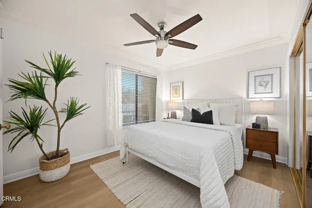 a bathroom with a toilet a sink a mirror and a bathtub