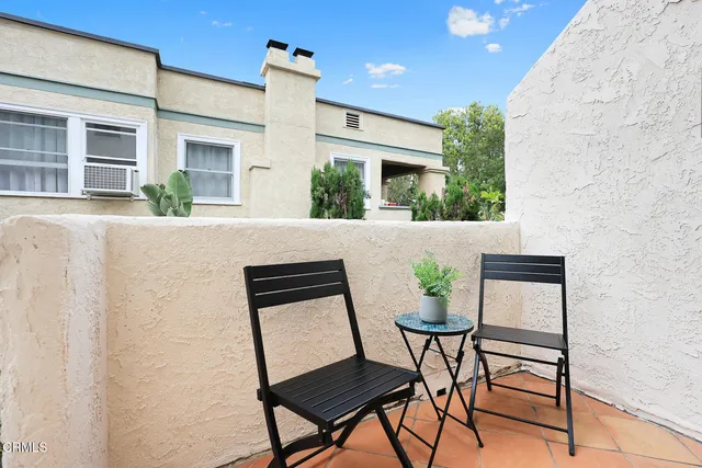 a view of house with wooden stairs and furniture