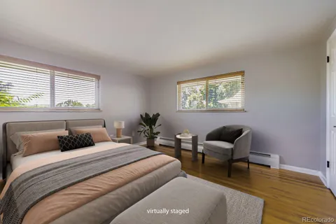 a bedroom with furniture and a window