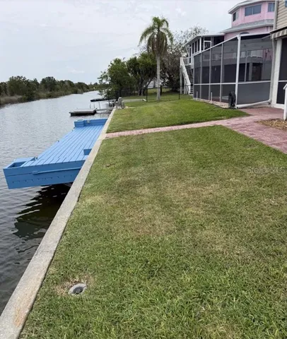 a view of a backyard with a lake view