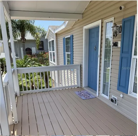 a view of balcony with wooden floor