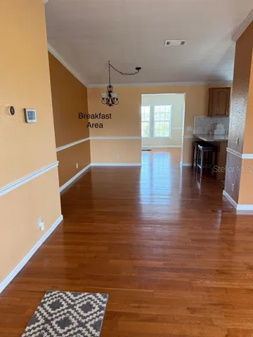 a view of livingroom with hardwood floor and furniture