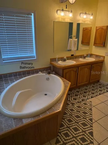 a bathroom with a bathtub and a sink