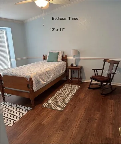 a bedroom with a bed and a table