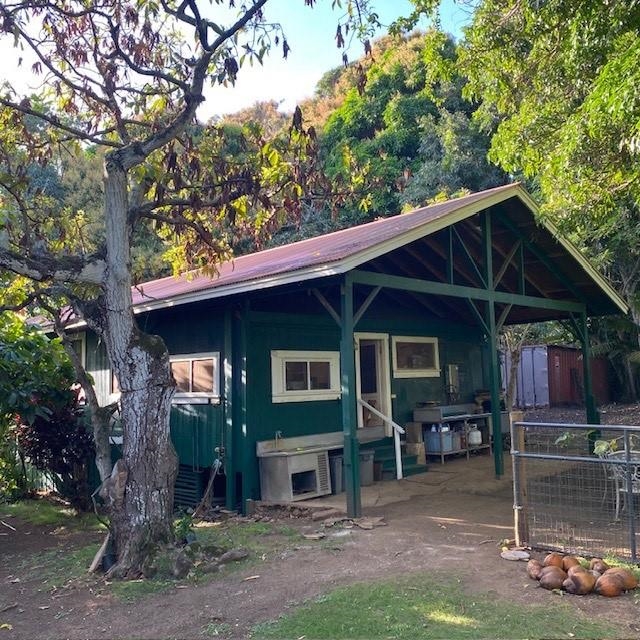 1264 Malaihi Road Wailuku, HI 96793 - Photo 8 of 17 a backyard of a house with barbeque oven fire pit table and chairs