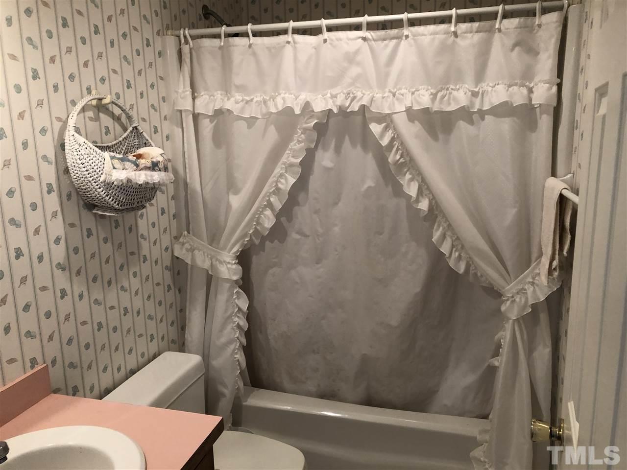 5330 Thomas Road Henderson, NC 27537 - Photo 14 of 19 a bathroom with a shower and toilet