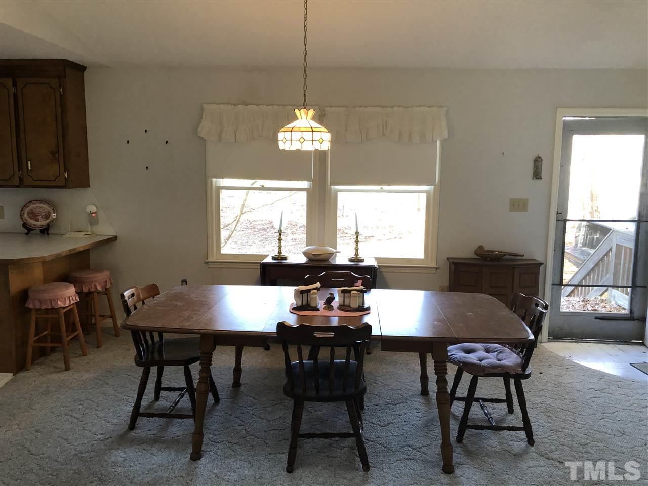 5330 Thomas Road Henderson, NC 27537 - Photo 8 of 19 a view of a dining room with furniture and window