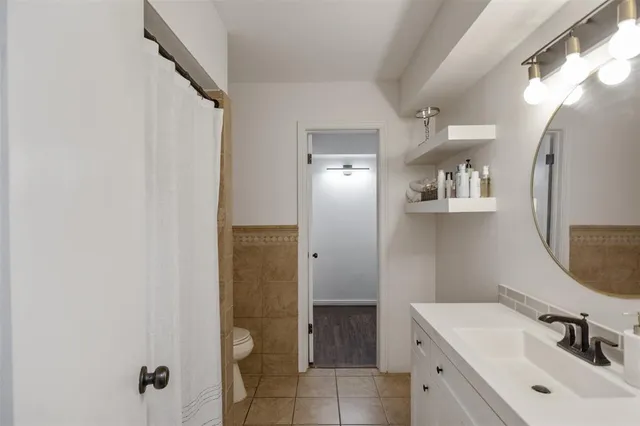 a bathroom with a sink and mirror