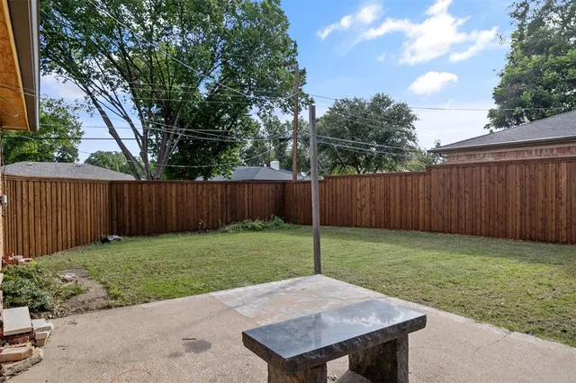 a view of a backyard with a house