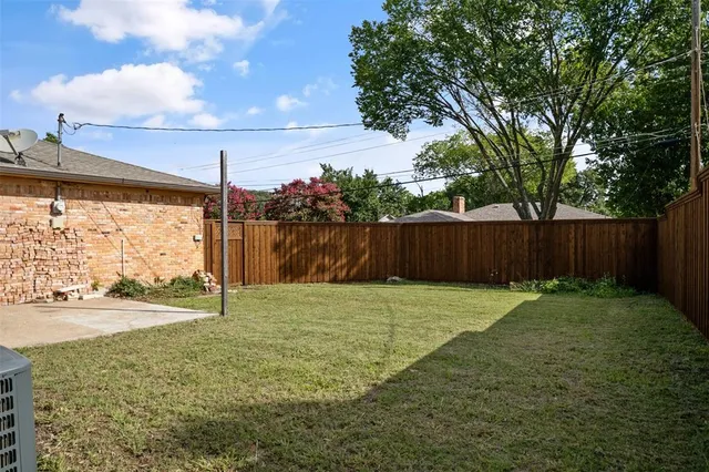 a backyard of a house with lots of green space