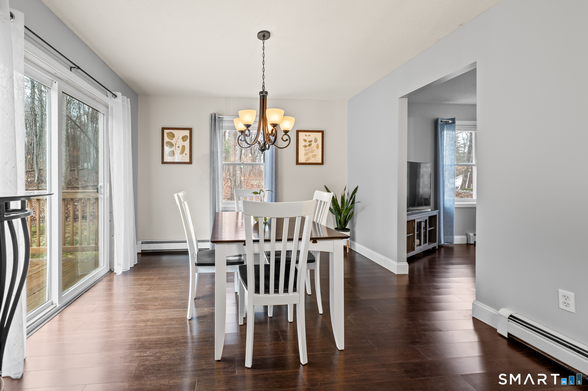 146 Lakeside Drive Andover, CT 06232 - Photo 35 of 35 a view of a livingroom with furniture wooden floor windows and a chandelier