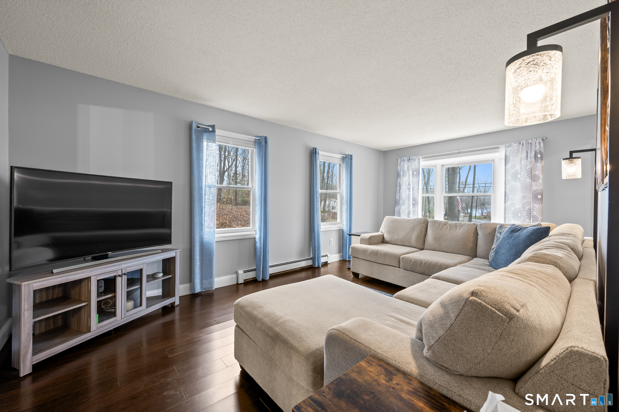 146 Lakeside Drive Andover, CT 06232 - Photo 13 of 35 a living room with furniture and a flat screen tv