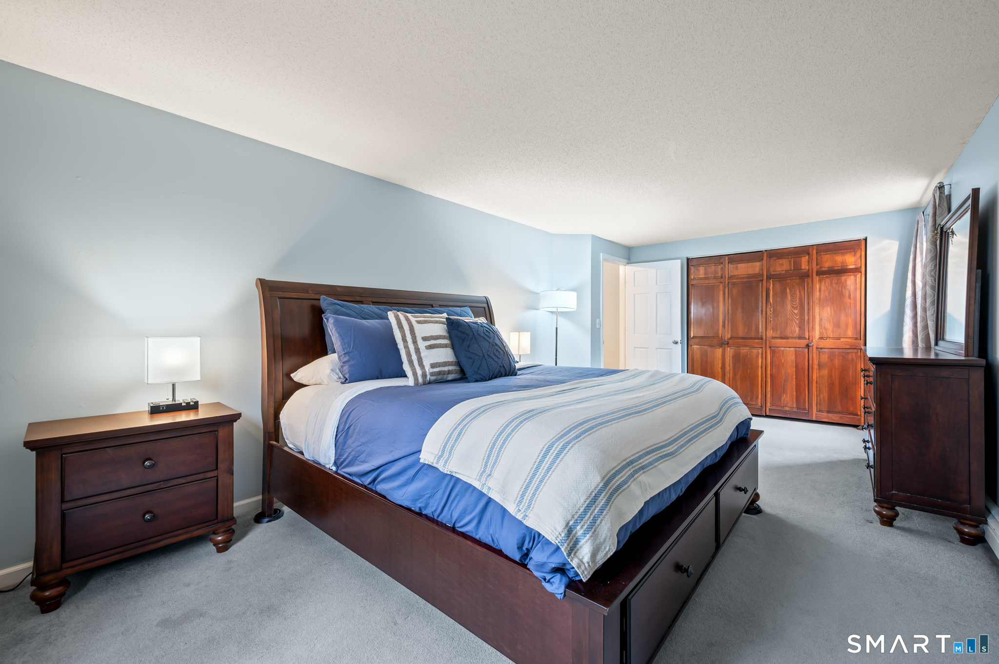 146 Lakeside Drive Andover, CT 06232 - Photo 15 of 35 a bedroom with a bed and a dresser