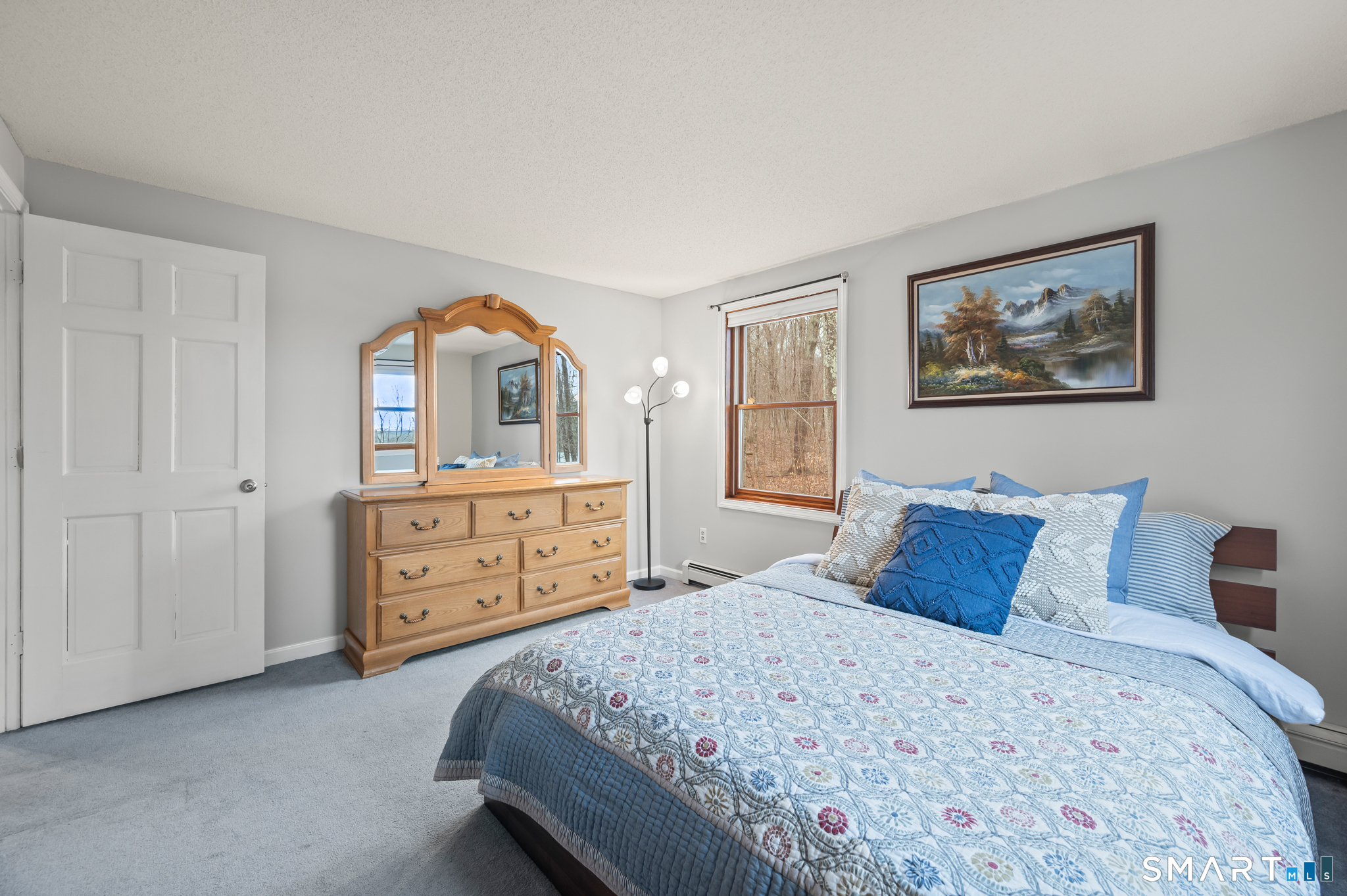 146 Lakeside Drive Andover, CT 06232 - Photo 18 of 35 a bedroom with a bed and a dresser