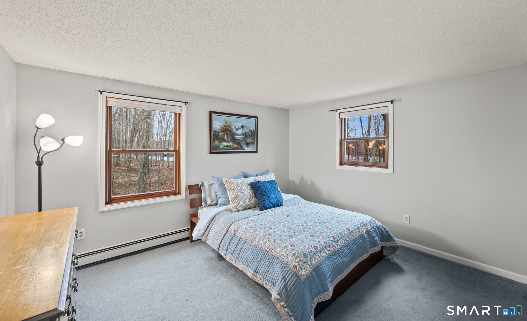 146 Lakeside Drive Andover, CT 06232 - Photo 19 of 35 a bedroom with a bed and a window