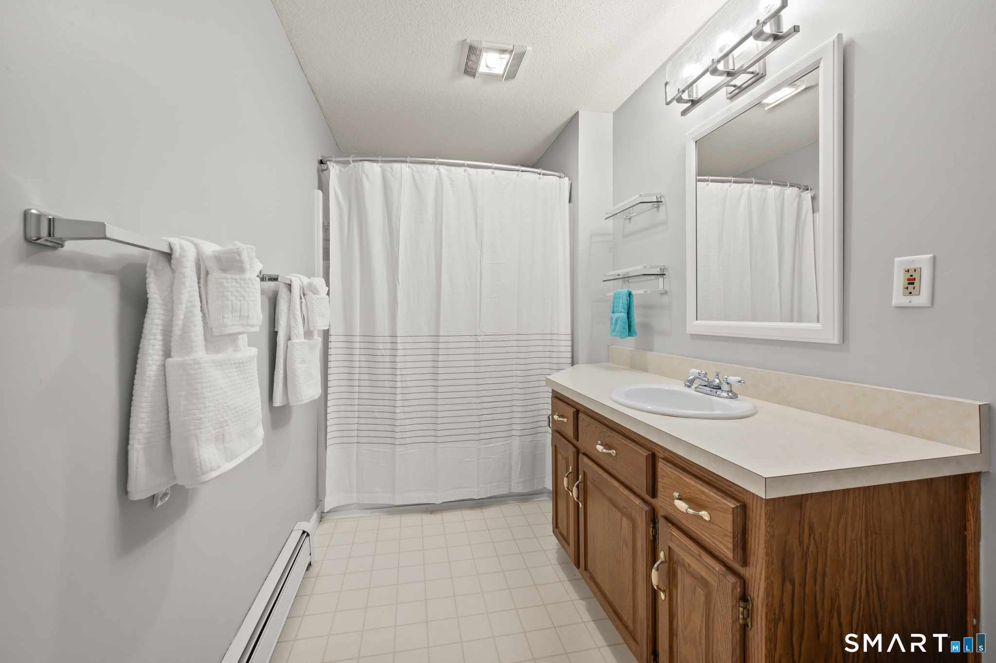 146 Lakeside Drive Andover, CT 06232 - Photo 21 of 35 a bathroom with a sink and mirror