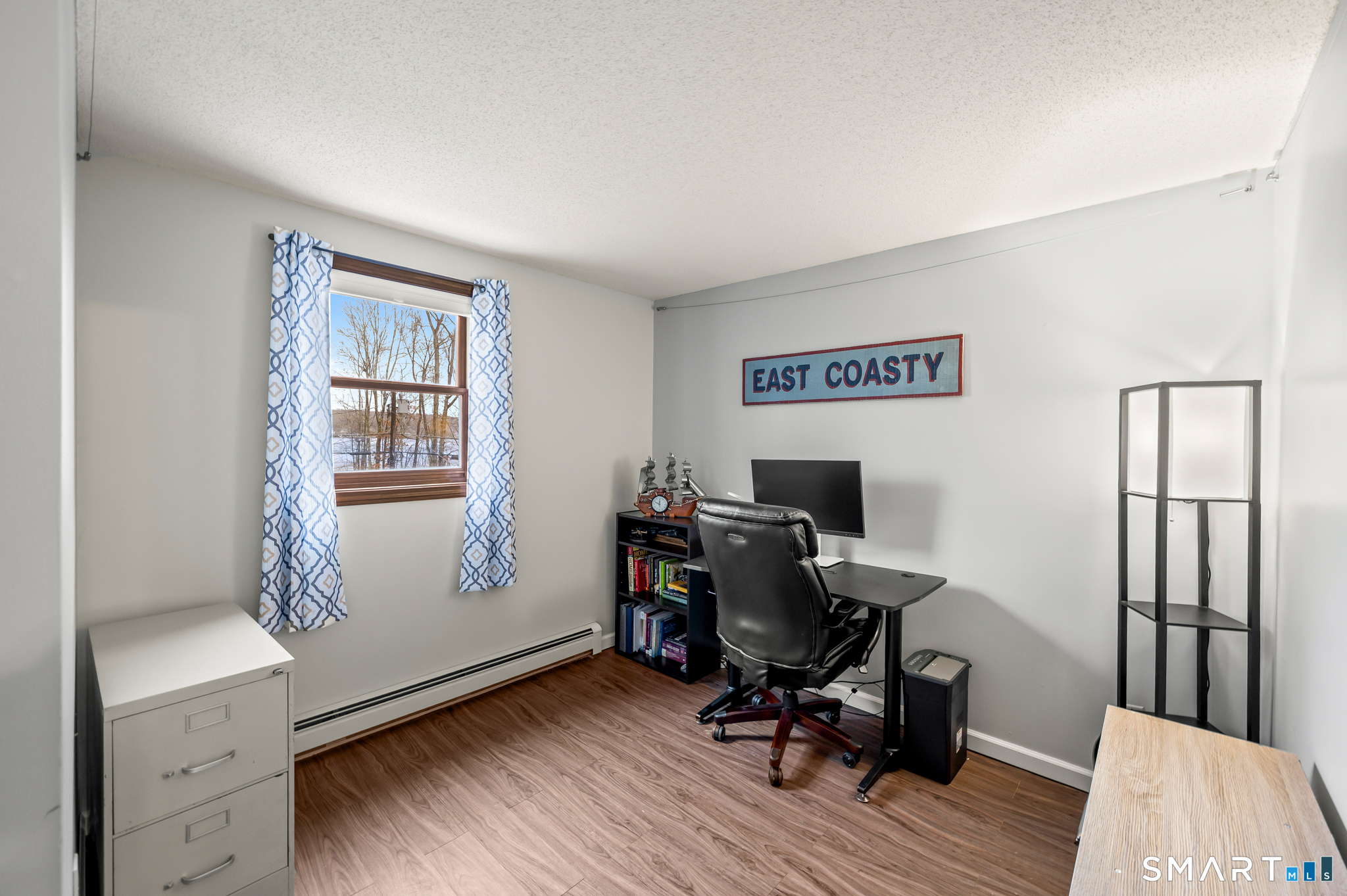 146 Lakeside Drive Andover, CT 06232 - Photo 22 of 35 a view of a workspace with furniture and a window