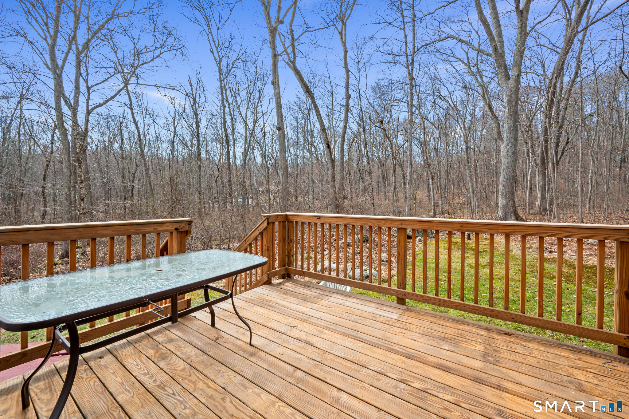146 Lakeside Drive Andover, CT 06232 - Photo 26 of 35 a view of balcony with wooden floor and bench