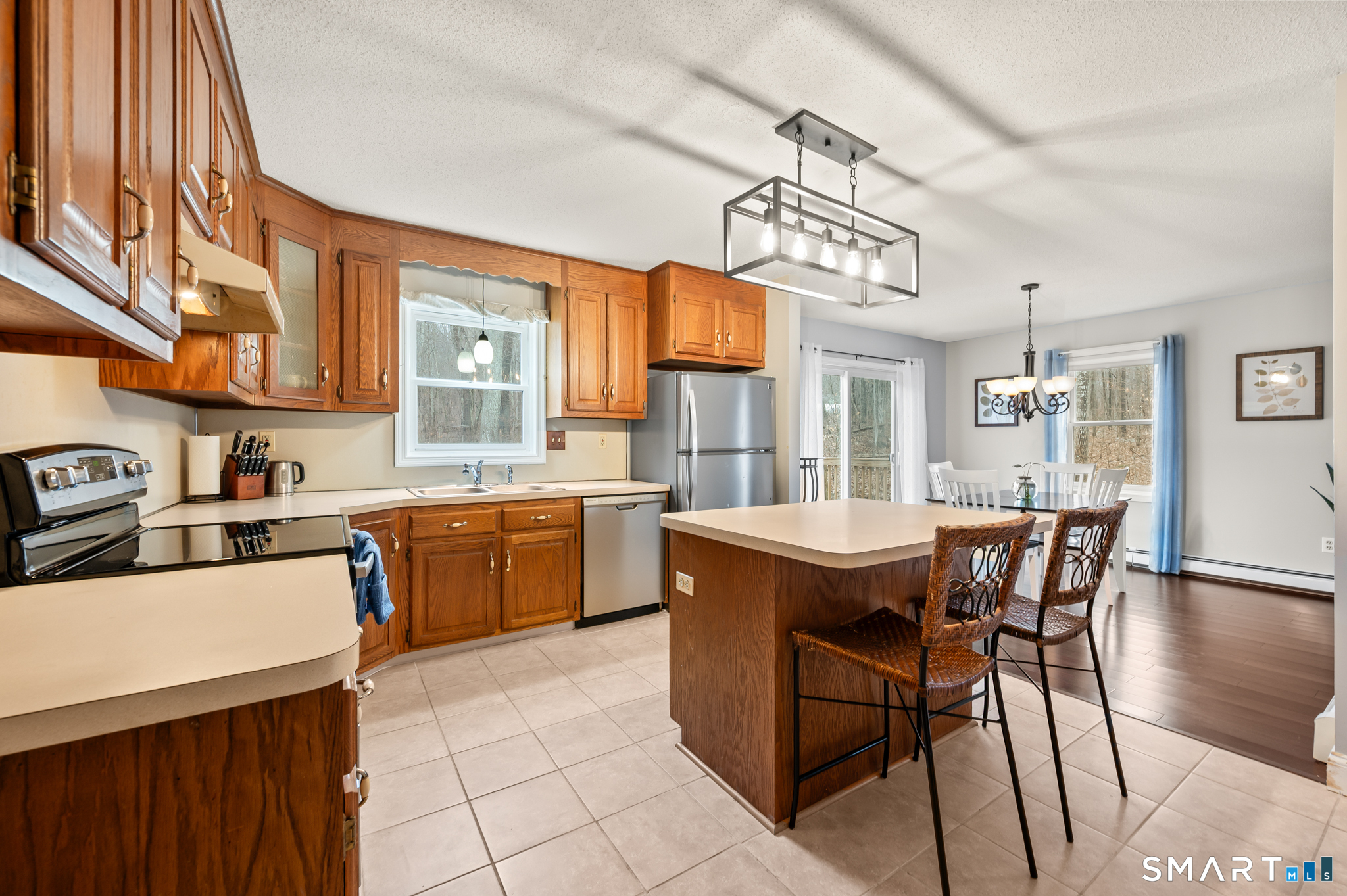 146 Lakeside Drive Andover, CT 06232 - Photo 5 of 35 a view of a kitchen and dining room