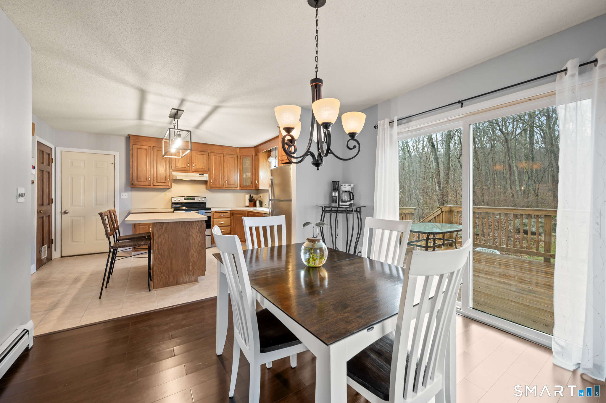 146 Lakeside Drive Andover, CT 06232 - Photo 8 of 35 a view of a dining room with furniture window and wooden floor