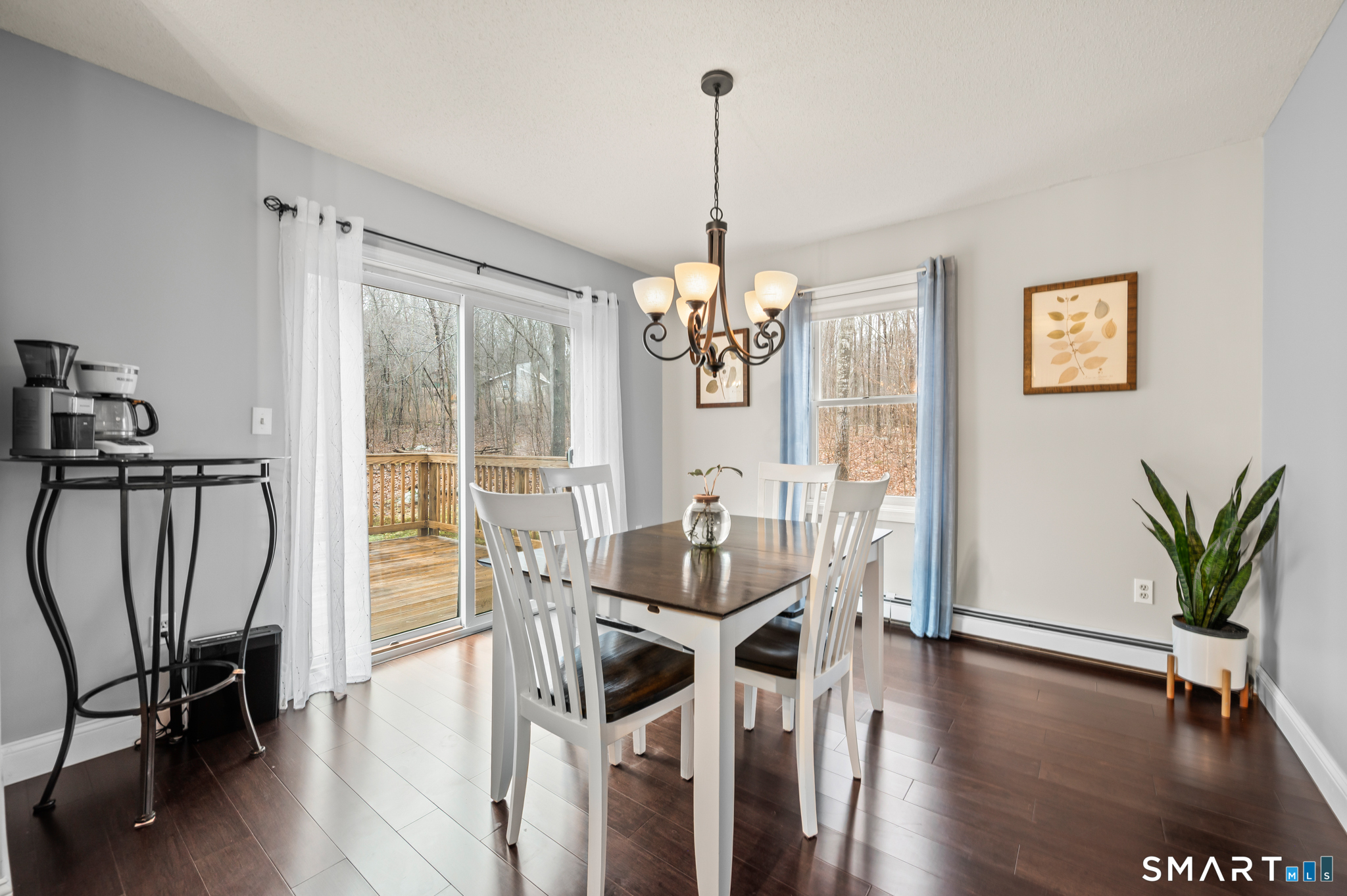 146 Lakeside Drive Andover, CT 06232 - Photo 9 of 35 a view of a dining room with furniture window and wooden floor