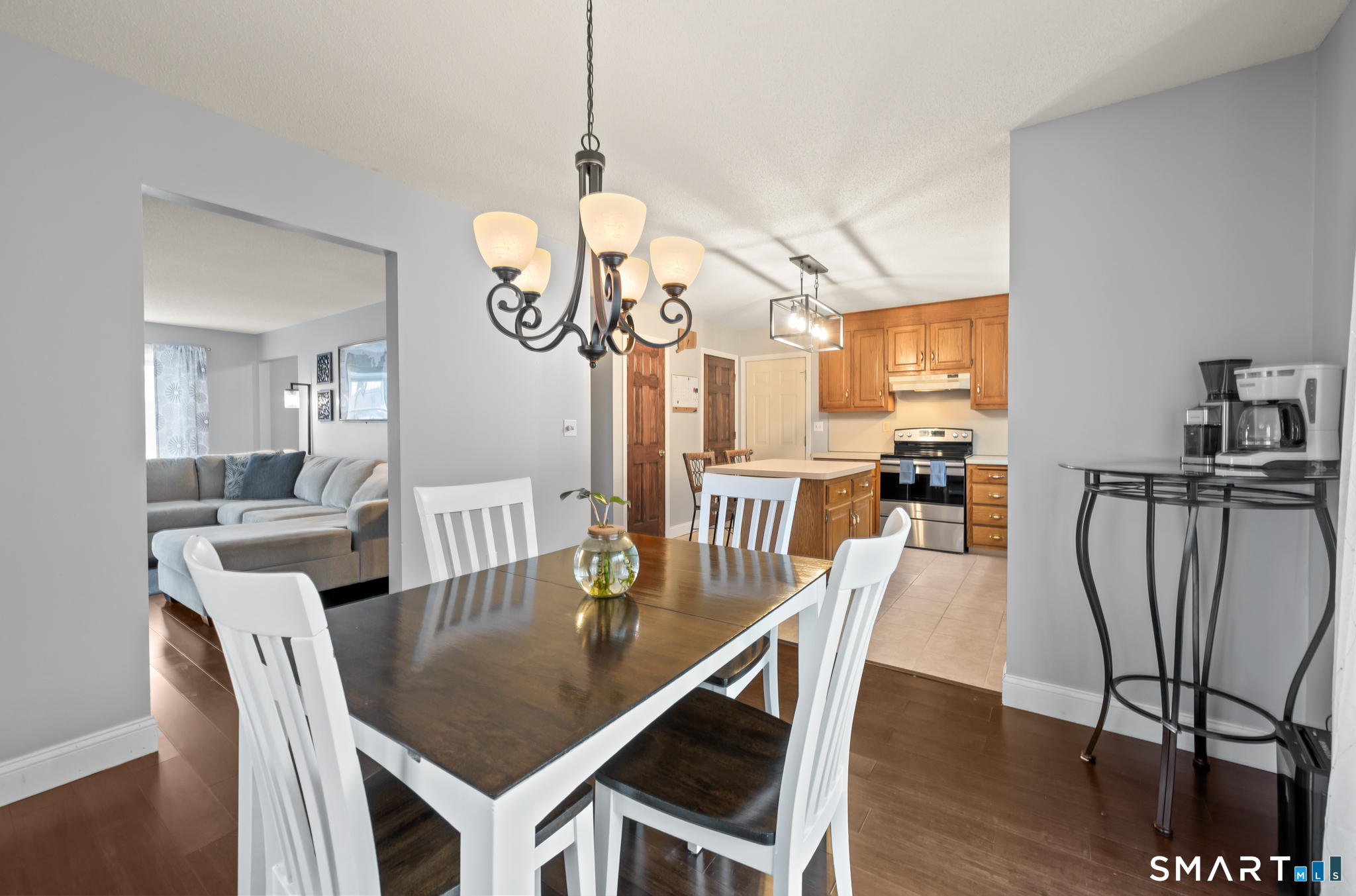 146 Lakeside Drive Andover, CT 06232 - Photo 10 of 35 a dining room with furniture a chandelier and wooden floor