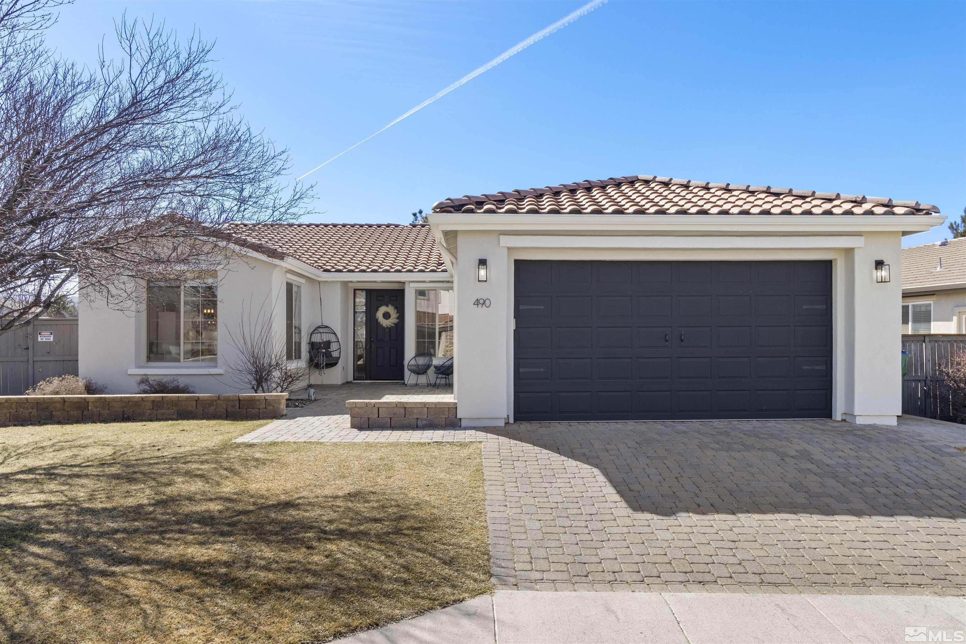 a front view of a house with yard