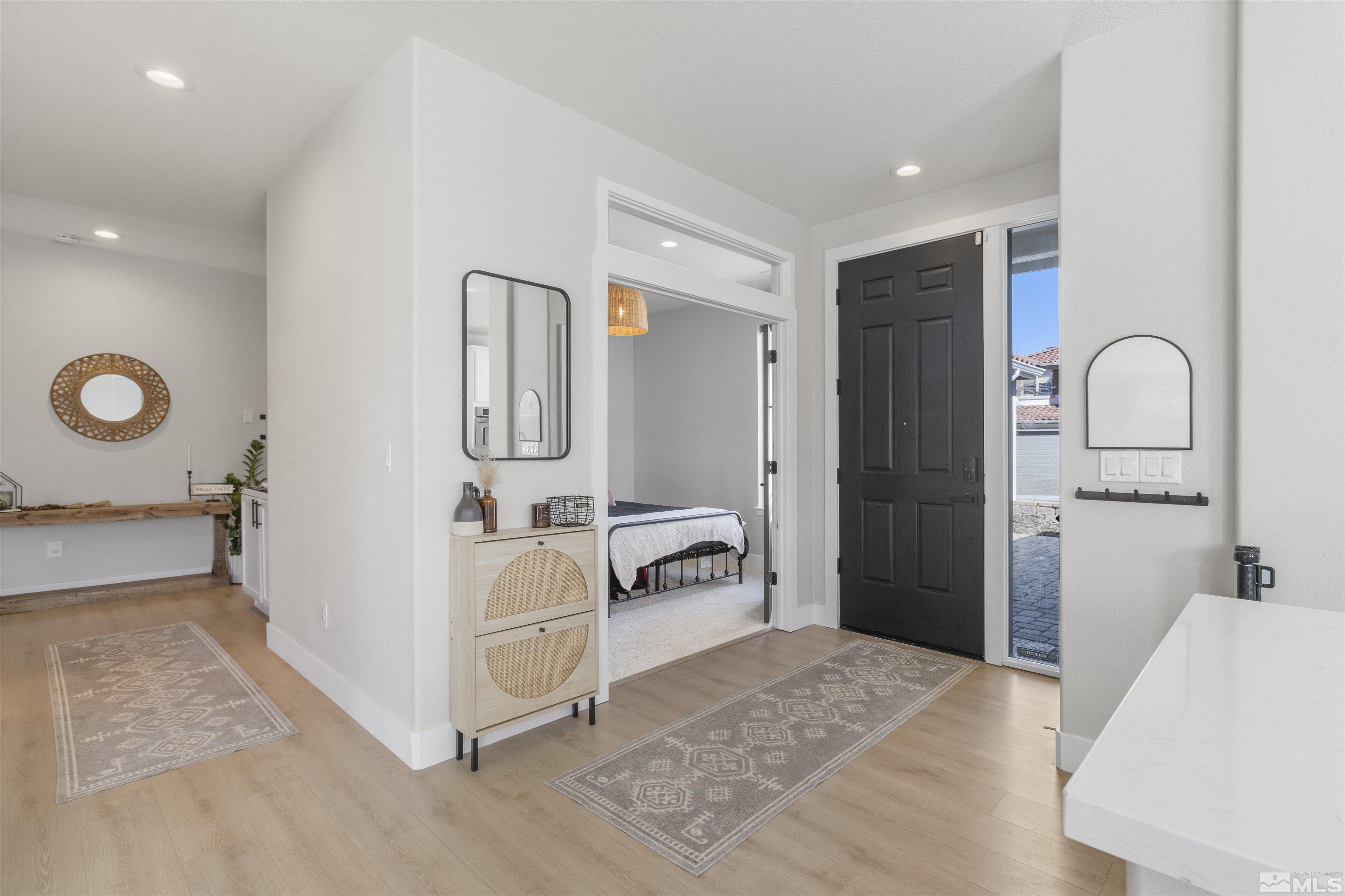490 Haleb Court Reno, NV 89521 - Photo 15 of 26 a bedroom with a bed and a large mirror