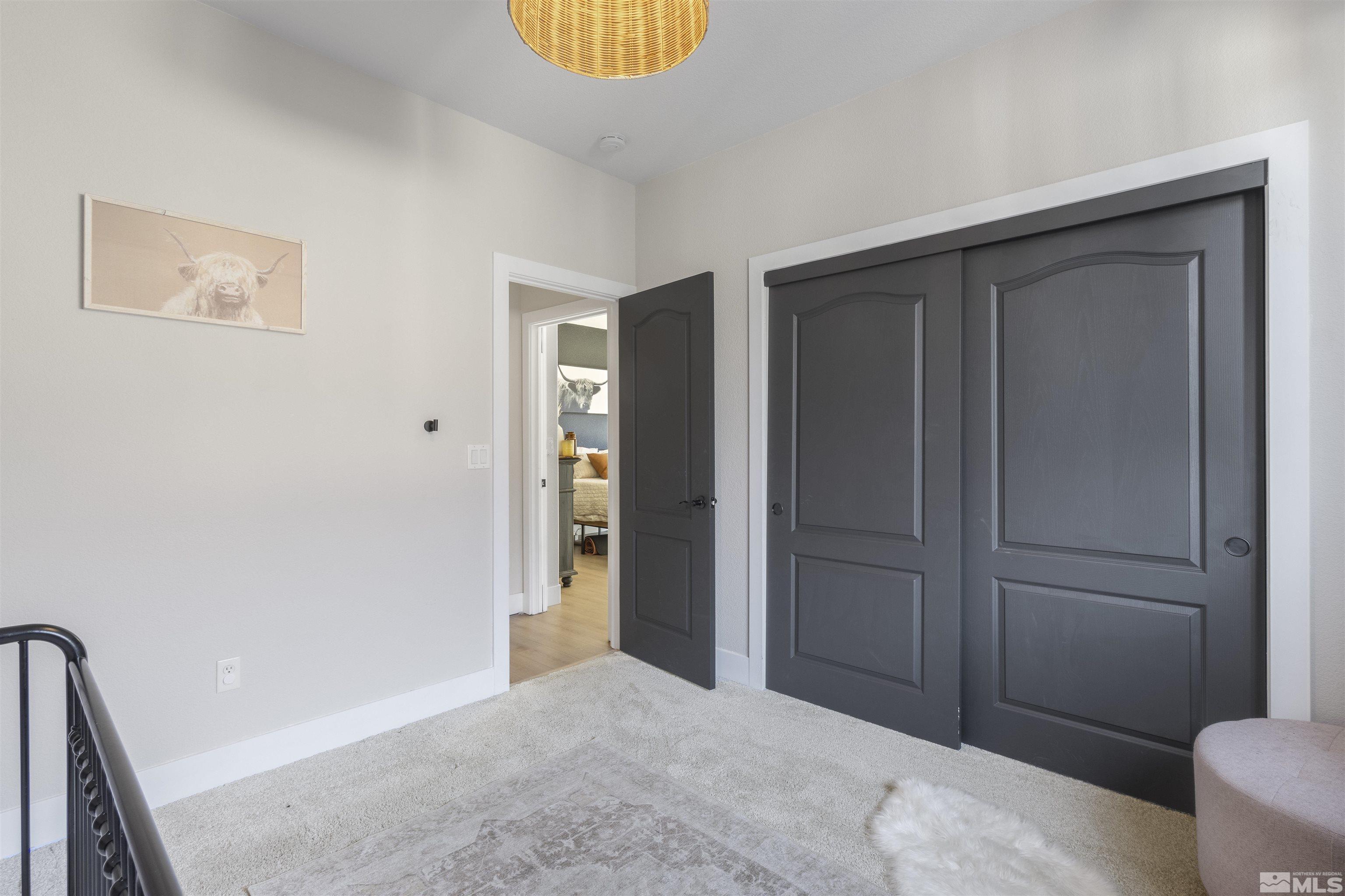 490 Haleb Court Reno, NV 89521 - Photo 22 of 26 a bedroom with a bed and a dresser